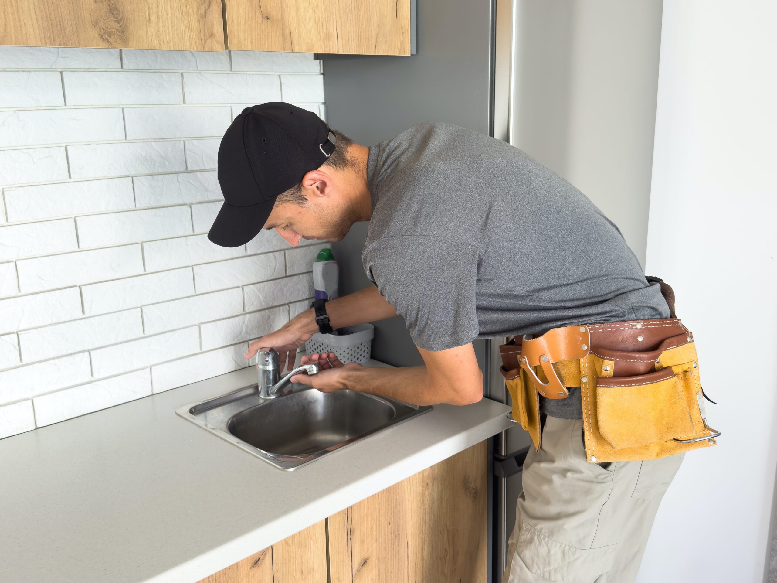 Faucets installation for modern home design trends in a contemporary kitchen with sleek fixtures